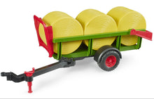 Bruder Self loading bale trailer with 3 round hay bales