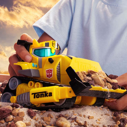Tonka Bumblebee bulldozer toy scooping rocks with its front blade
