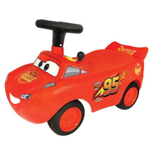 Red Lightning McQueen ride-on car, black seat and handle, number 95 on side