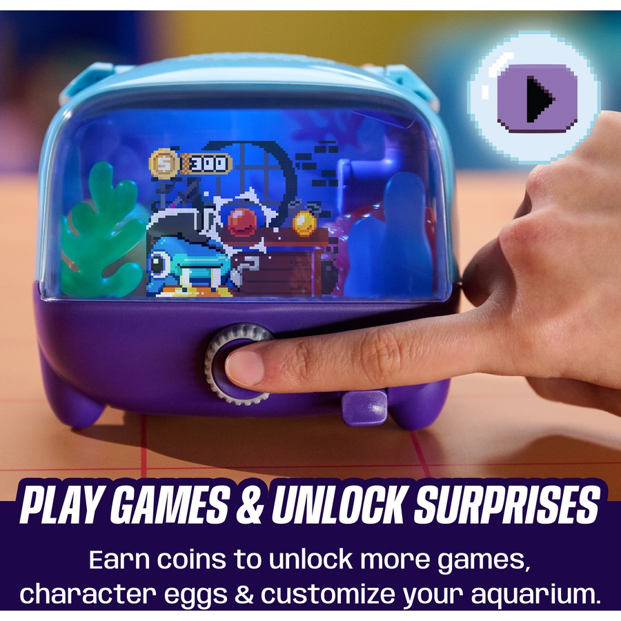 Interactive digital pet aquarium showing pixel pet scene, hand holding the front dial