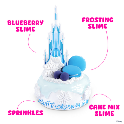 Icy blue slime cake with white frosting, blue domes, purple topping, and sparkle pieces