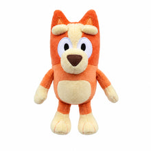 Orange plush dog toy with big ears and embroidered face