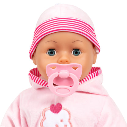 Close-up pink baby doll face with striped beanie and cupcake patch on hoodie