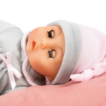 Grey baby doll face close-up in hooded hat with soft pink trim