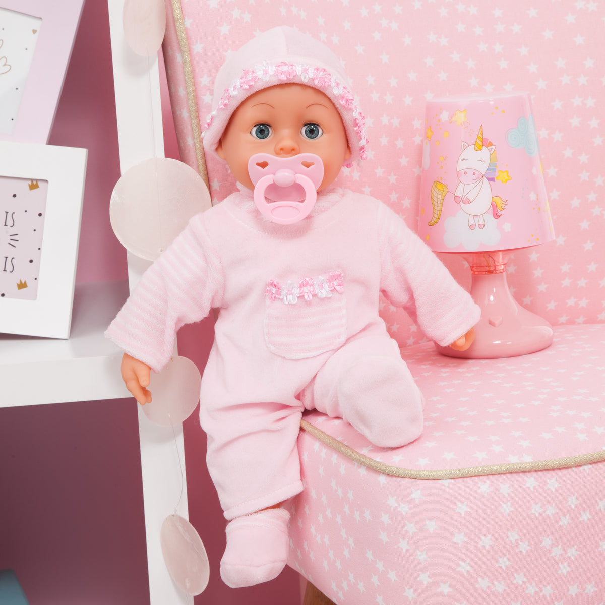 Pink 38 cm baby doll wearing a hooded outfit and pacifier