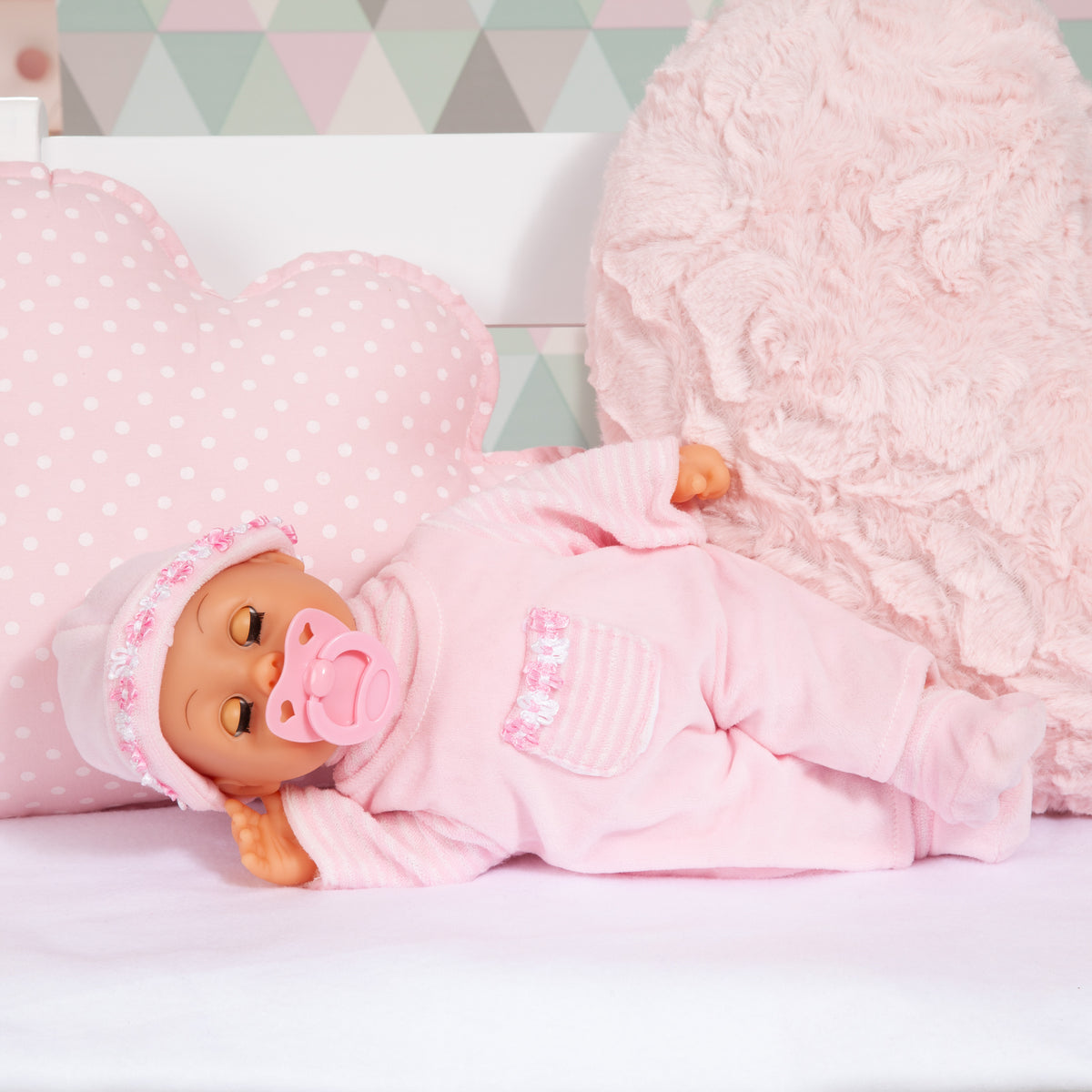 Pink 38 cm baby doll lying down, hooded outfit and pacifier