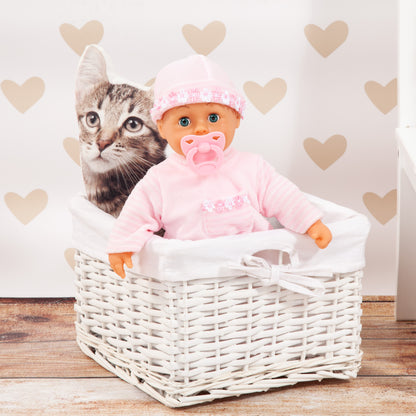 Pink 38 cm baby doll in a white basket, wearing a hood and pacifier