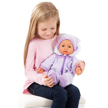 Child seated holding a 46cm soft body baby doll in lilac zip-up hooded pajamas