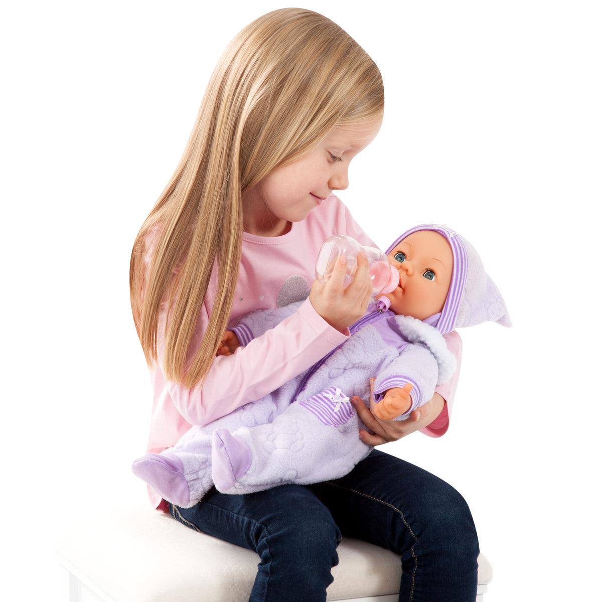 Child cuddling a 46cm soft body baby doll with lilac hooded outfit