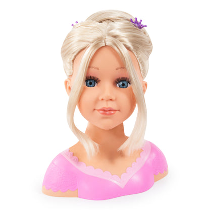 Blonde styling doll head with side bangs and purple hair clips, pink dress top