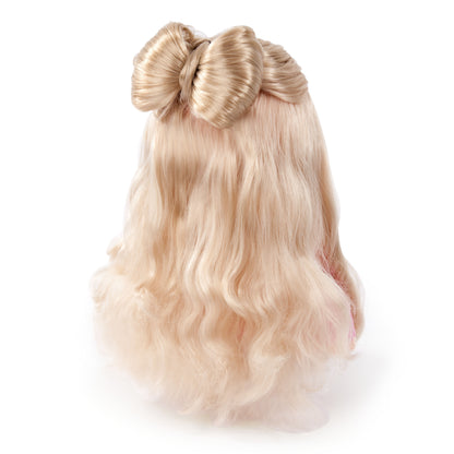 Blonde doll head back view with large top knot bun
