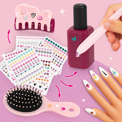 Pink manicure set with nail stickers, polish bottle, tools, and press-on nails
