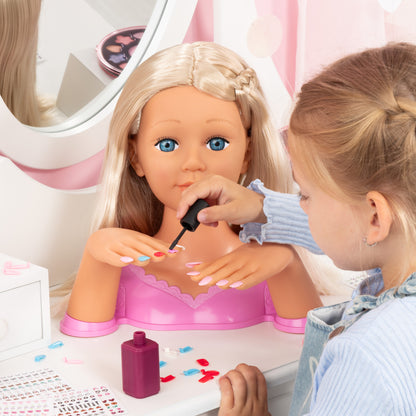 Blonde styling head doll with magenta dress top as a child applies nail polish