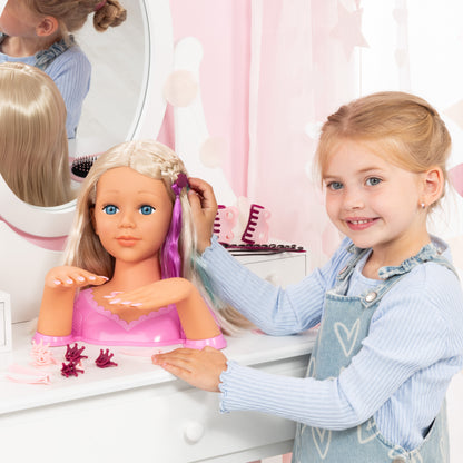 Blonde doll styling head with long hair as a child brushes and adjusts purple clips