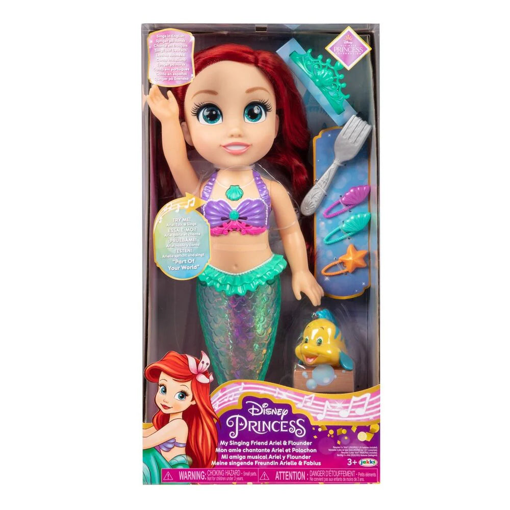Boxed singing mermaid doll with red hair, crown, purple top, and teal tail