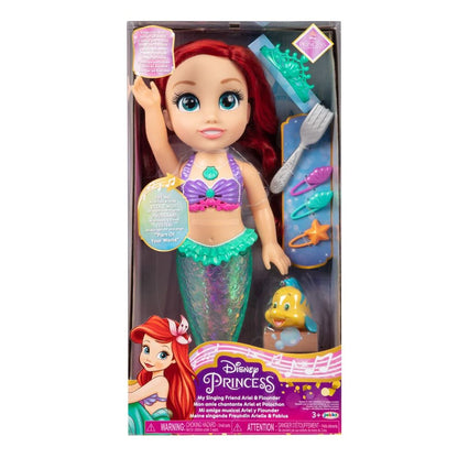 Boxed singing mermaid doll with red hair, crown, purple top, and teal tail
