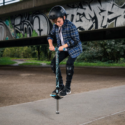 Pogo stick in use with rider wearing helmet, blue grips and black graphic deck