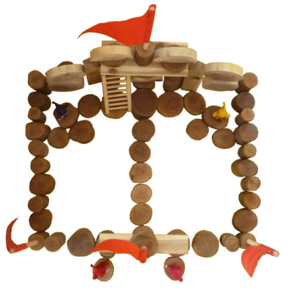 Wooden castle blocks ring set with red flags, ladder pieces, and small toy figures