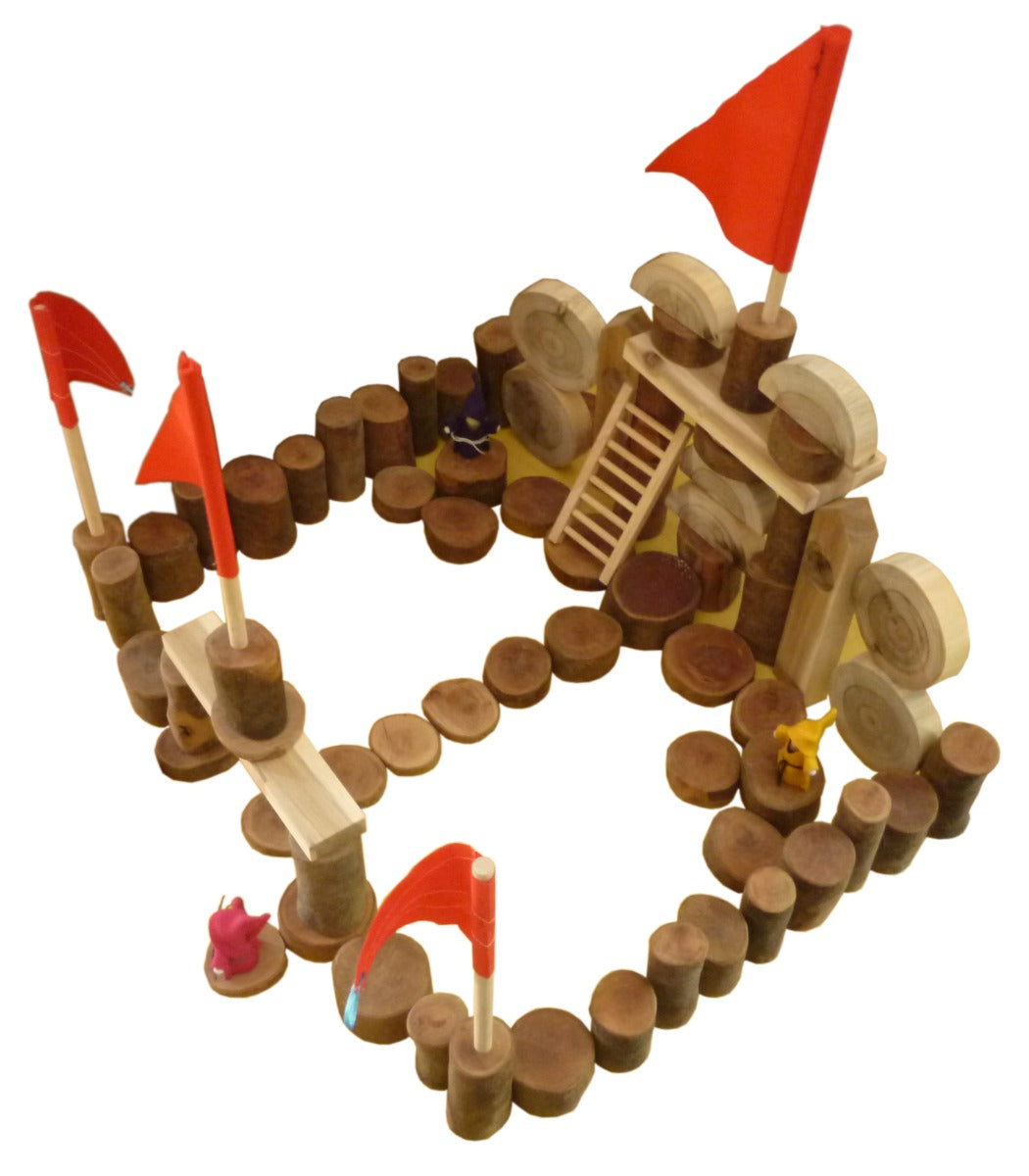 Wooden castle blocks set arranged in a heart-shaped ring with red flags and figures