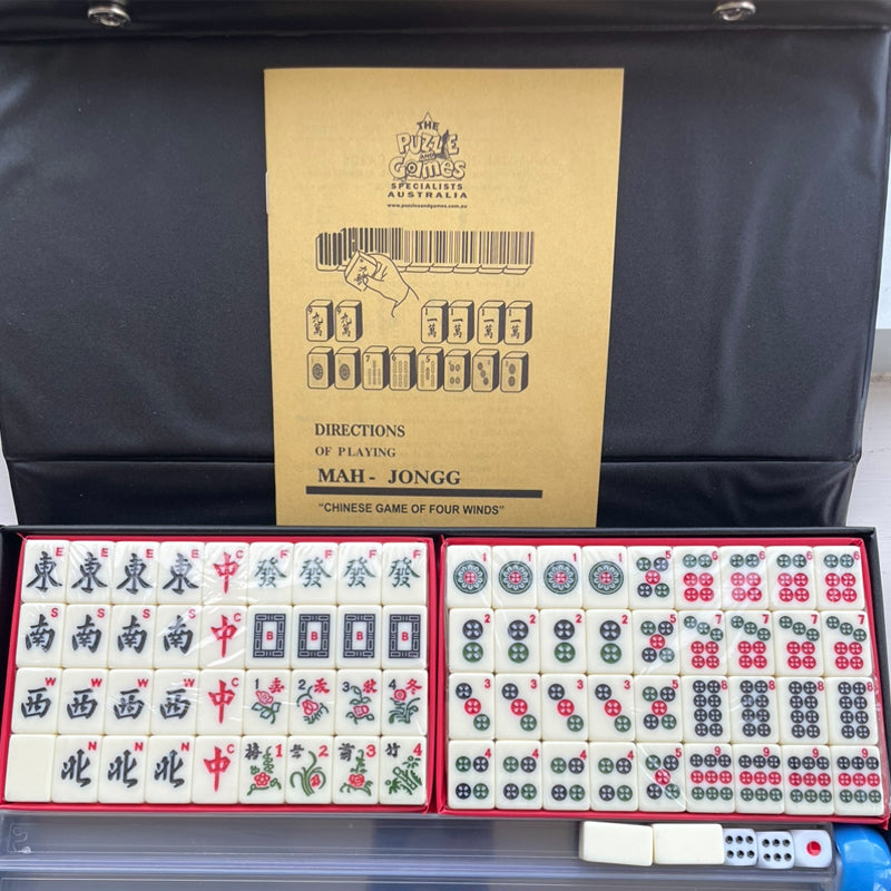 Travel Mahjong in a black vinyl case with Racks