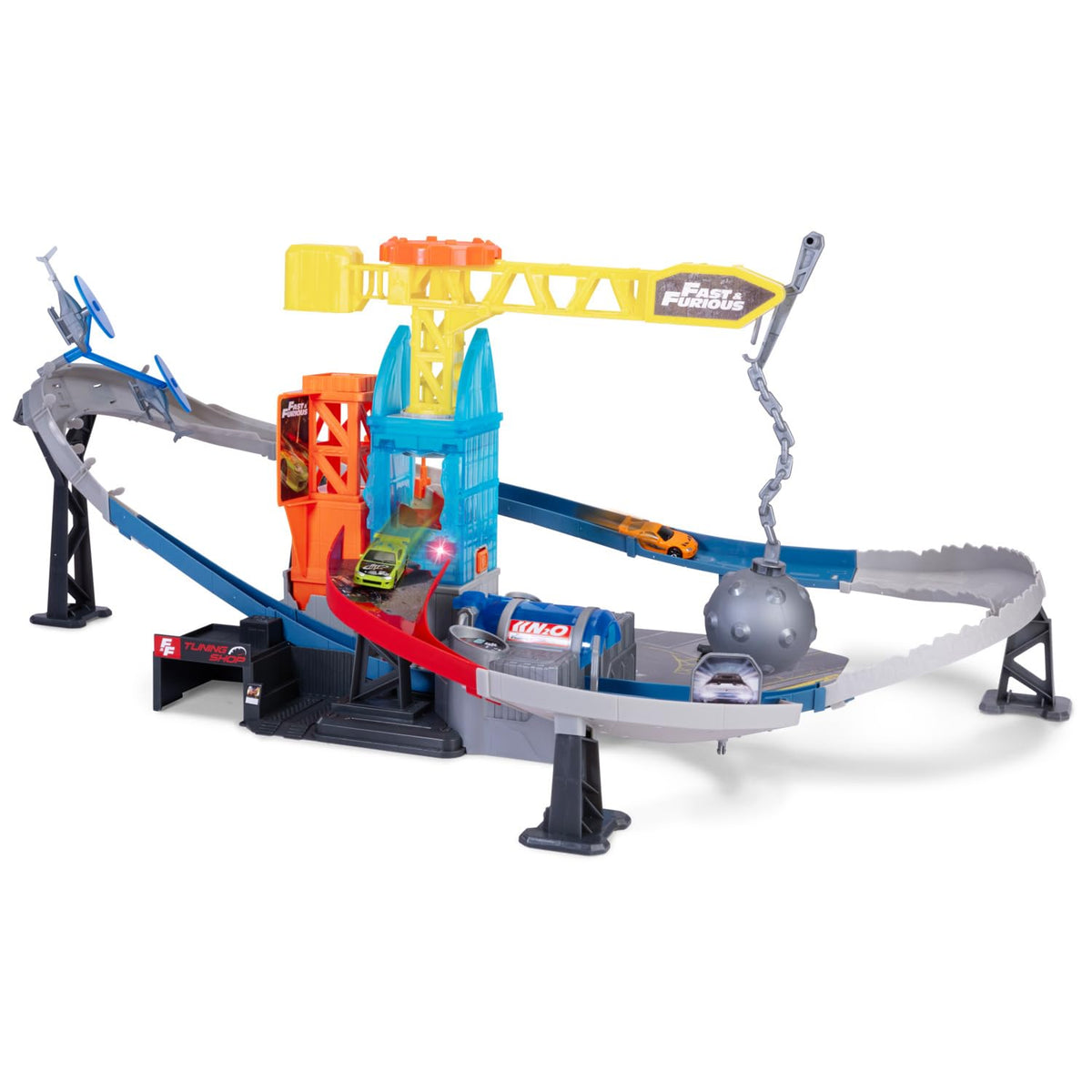 Toy ramp playset with yellow tower, curved track, and chained wrecking ball