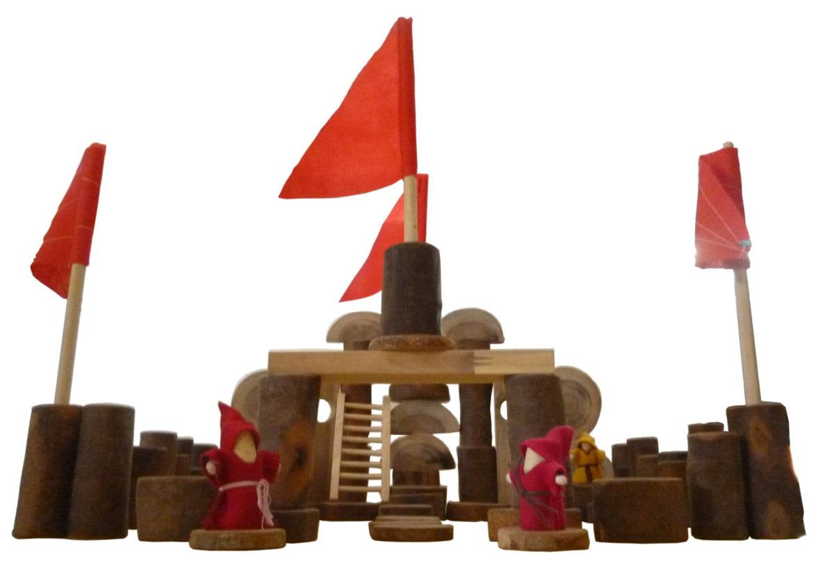 Wooden castle blocks set with three red flags, central ladder, and small toy figures
