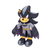Bat-themed plush character standing, gray suit with yellow accents and black cape