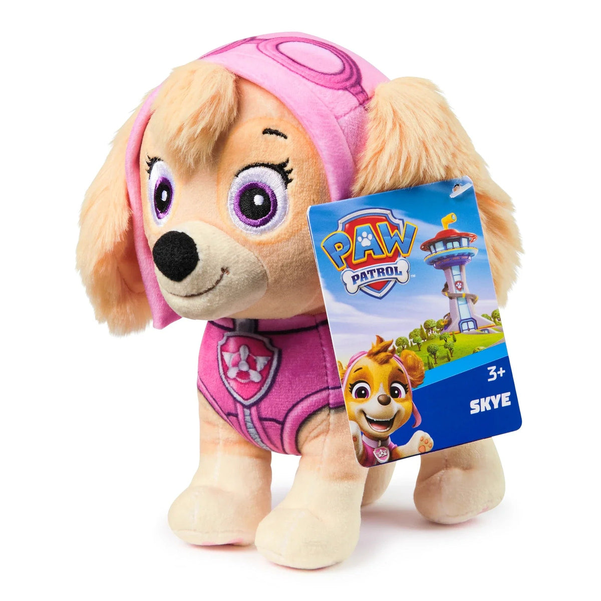 Paw Patrol Skye plush pup with pink hood, beige fur, purple eyes, holding Paw Patrol tag