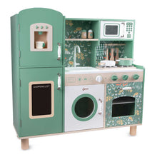 Freestanding wooden play kitchen set with stove, oven, microwave, and sink, green