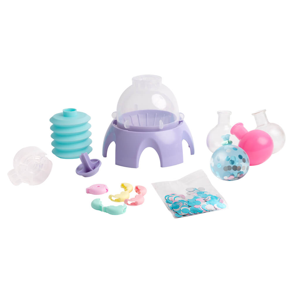 Mini squishy maker kit pieces: purple base, clear dome, molds, and colorful accessories.