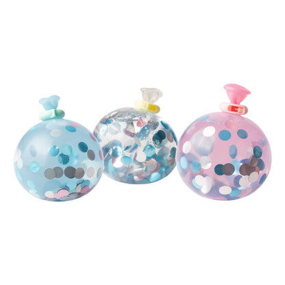 Three clear mini squishy bottles with blue, rainbow, and pink confetti and lids.