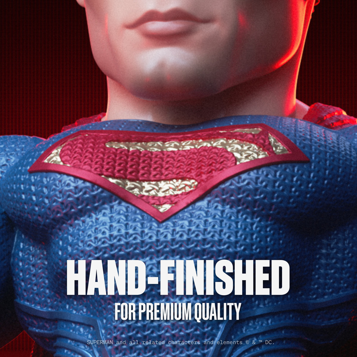 Close-up of DC Heroes mini figure torso in blue suit with red cape emblem