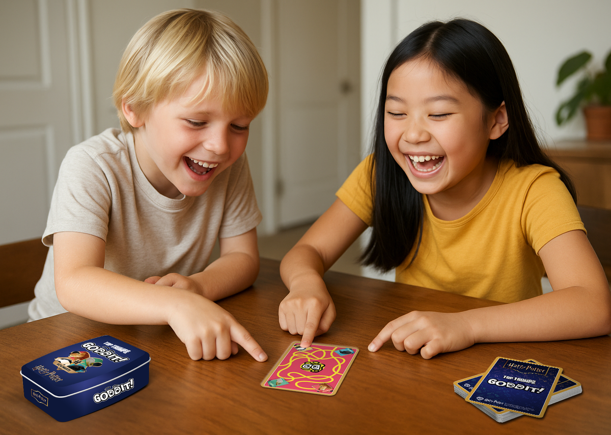 Wizard-themed card game cards with blue GODDIT! box on wooden table