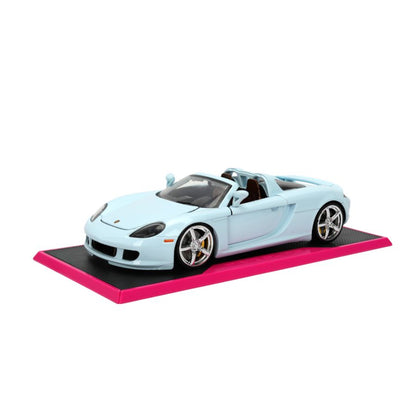 Light blue Porsche Carrera GT diecast on magenta display base, chrome wheels