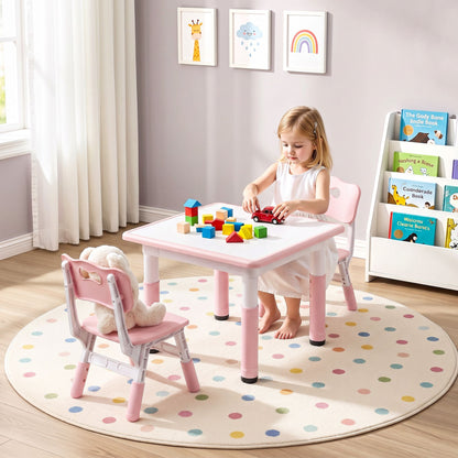 Toddler using pink kids activity table with 2 matching chairs on play mat