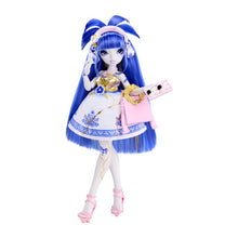 A fashion doll with long blue hair, wearing a white and blue dress with gold accents, holding a pink purse and a small rectangular accessory, photographed on a plain white background.