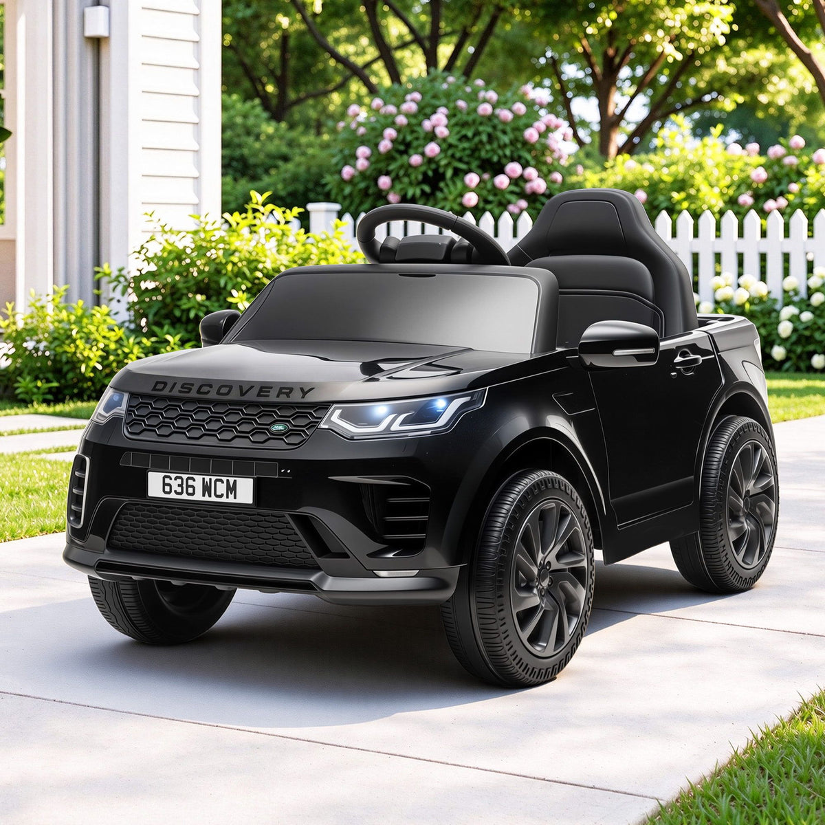 Black Land Rover Discovery ride-on SUV for kids with open cabin and detailed wheels