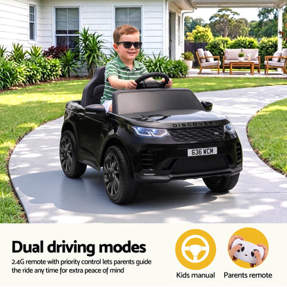 Child driving a black ride-on SUV with steering wheel and parent remote options
