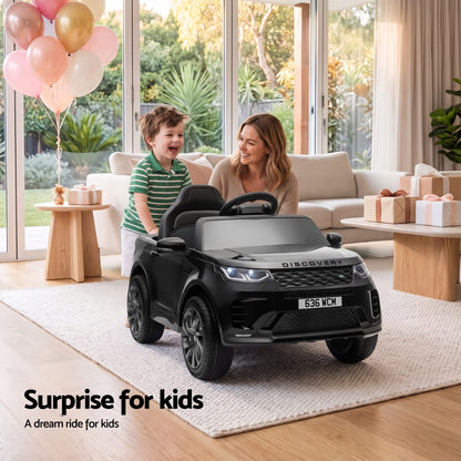 Land Rover Discovery black ride-on SUV with two seats, steering wheel, and rugged wheels