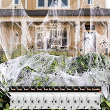 Stretchable white spider web decoration strip with small black spider accents