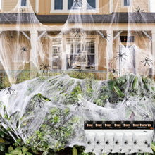 Halloween spider web decoration covering outdoor porch with small black spiders