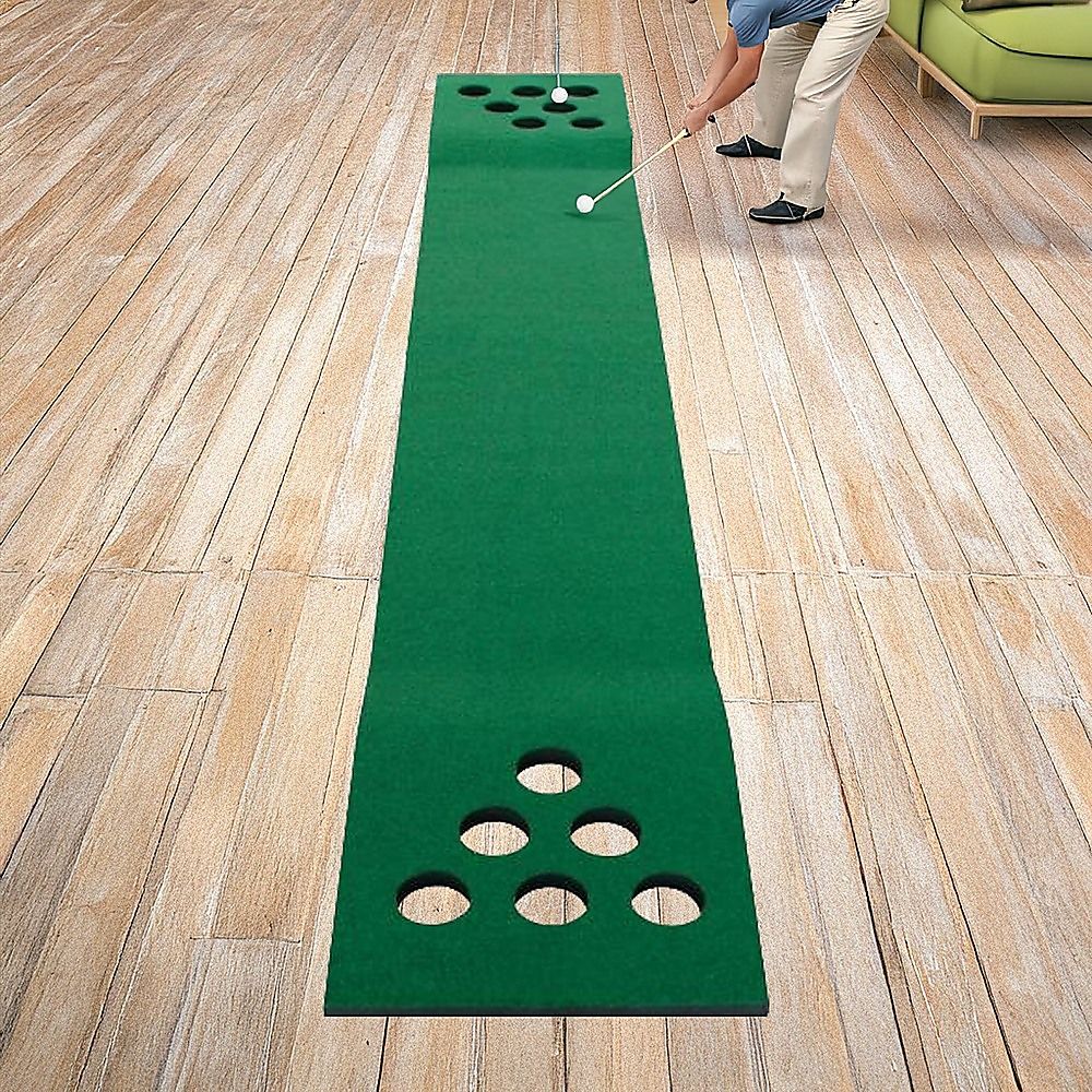 Long green putting mat with ball cup holes and foam balls for the game set