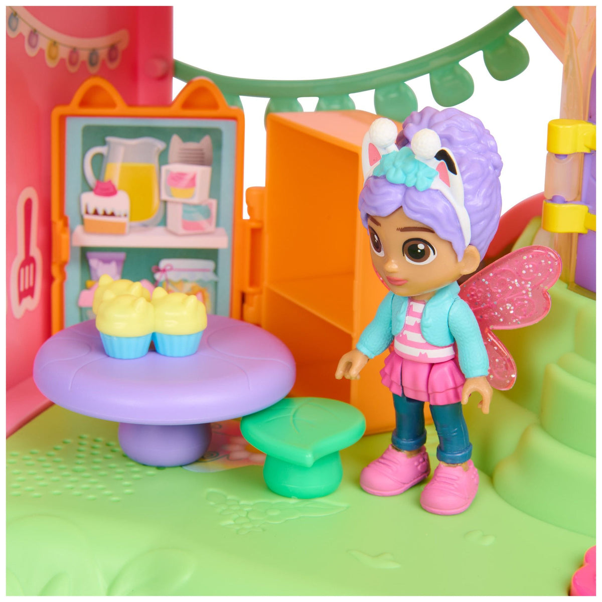 Fairy dollhouse interior with doll figure near purple table and orange storage walls
